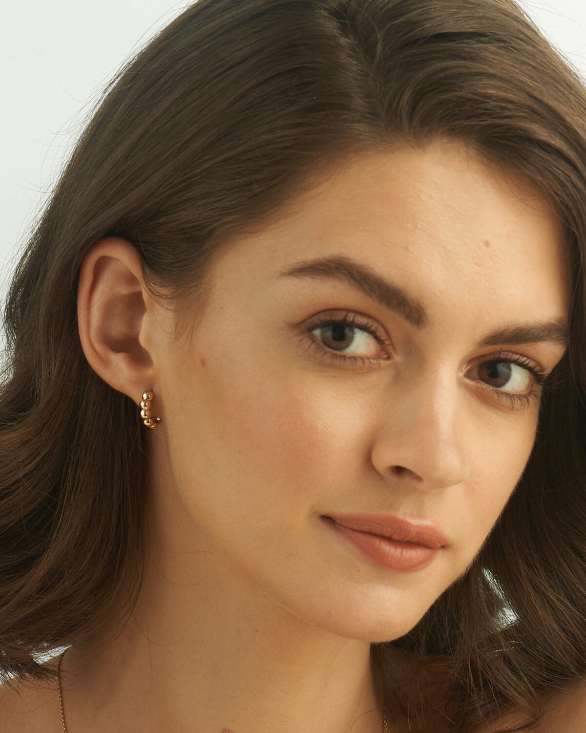 Textured view of chunky bubble bead earrings, showcasing the reflective surface.