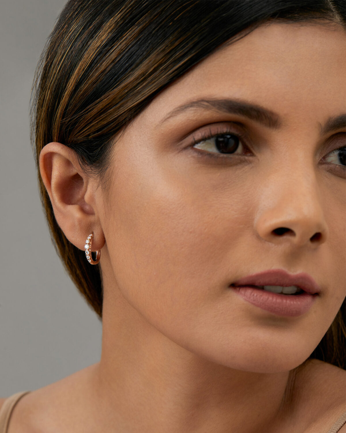 Close-up detail of lab grown diamonds in a graduated hoop setting.