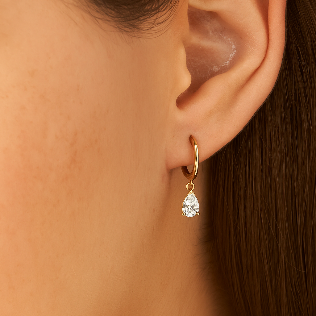 Minimalist hoop earrings featuring pear shaped lab diamonds