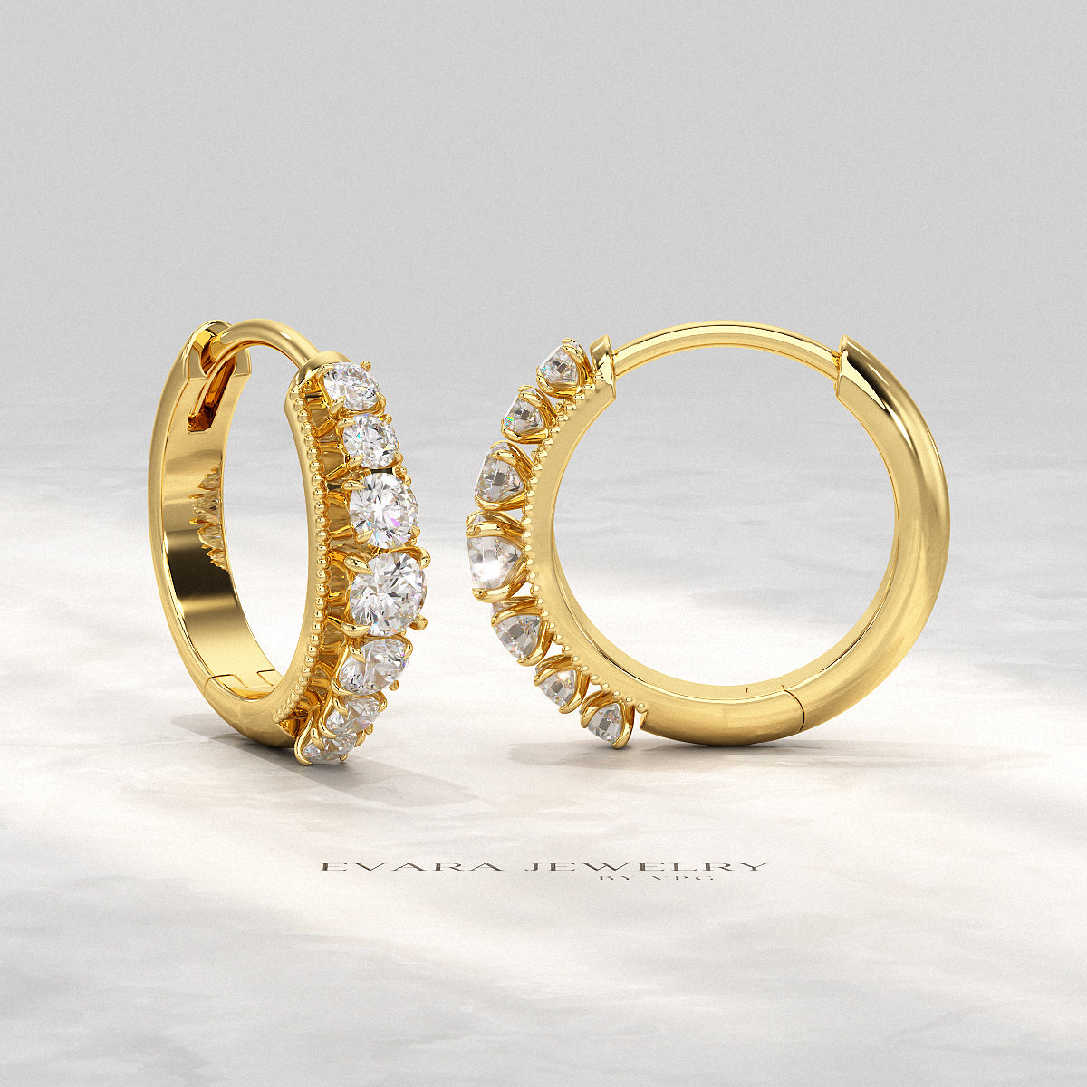 Modern hoop earrings featuring a row of graduated lab grown diamonds.