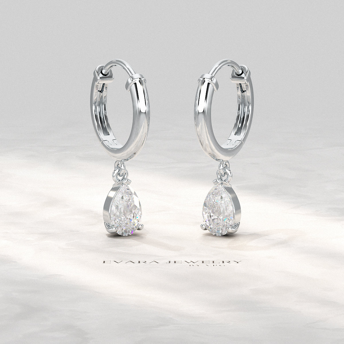 Angled view of pear cut lab-grown diamond hoop earrings