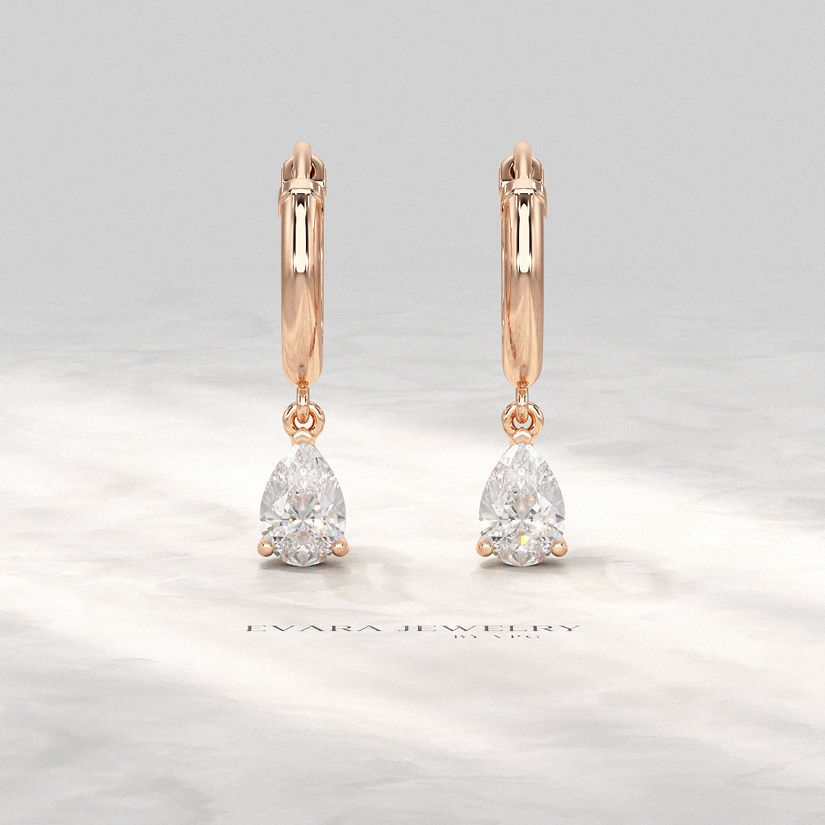 Side view of pear cut lab-grown diamond hoop earrings